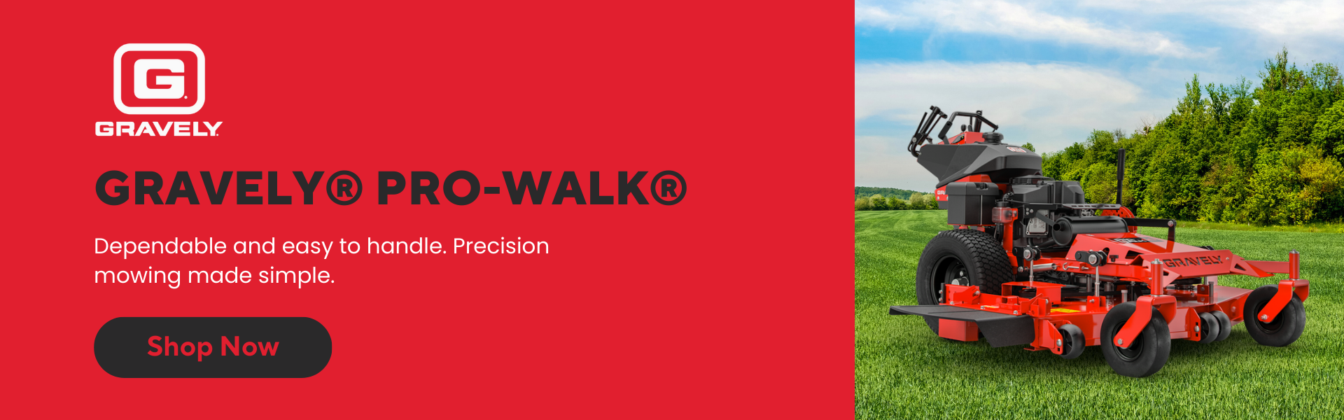 Gravely Pro-Walk commercial walk-behind mower on a manicured lawn with a forested area in the distance.
